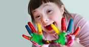 child finger painting